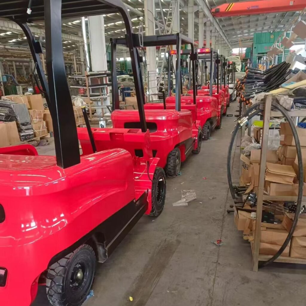 Red electric forklifts assembled in MIWO factory workshop